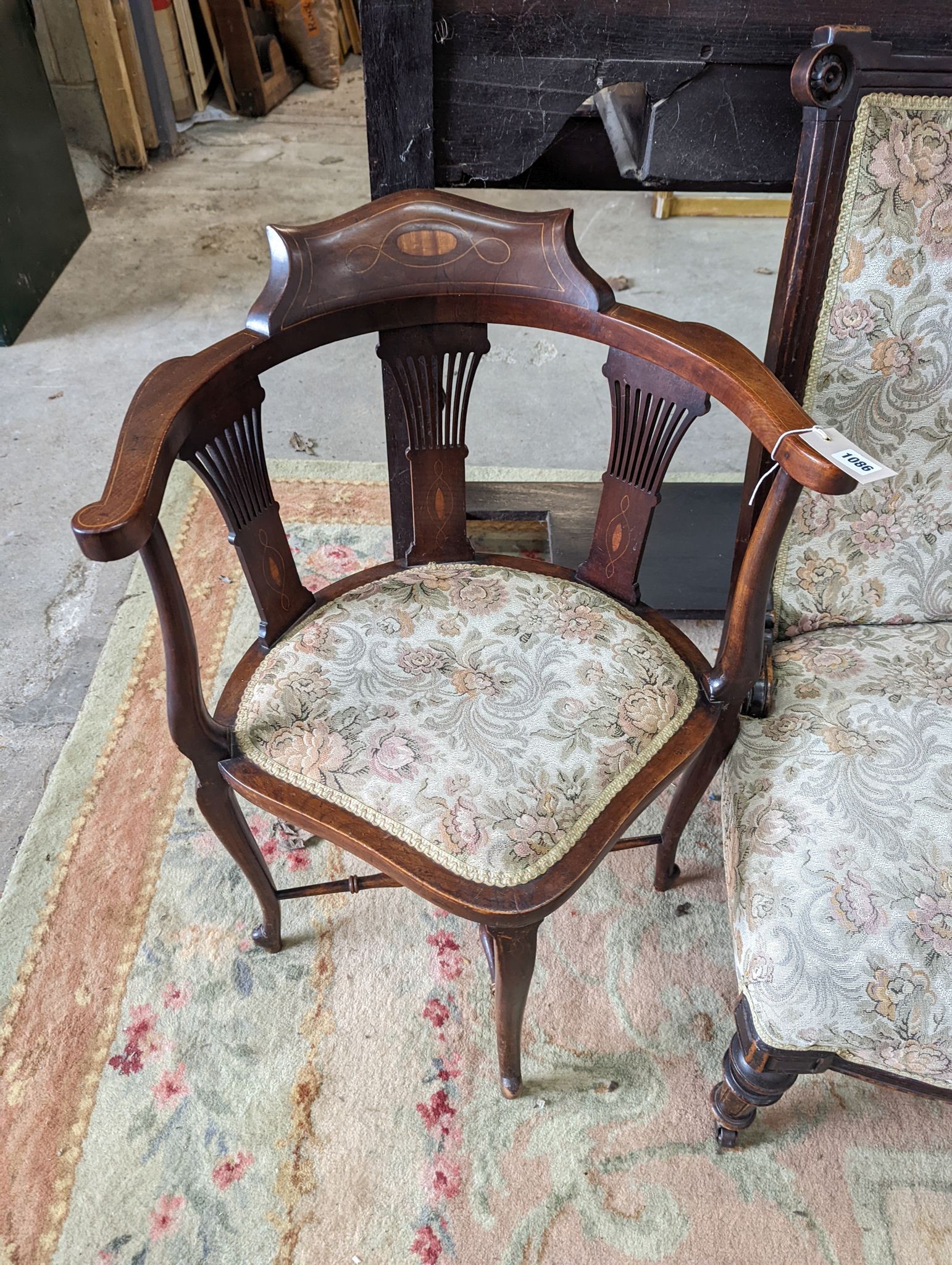 A late Victorian upholstered nursing chair and an Edwardian inlaid mahogany corner elbow chair